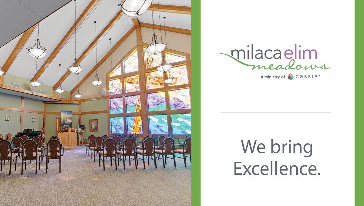 Interior chapel space at Milaca Elim Meadows featuring stained glass windows and seating