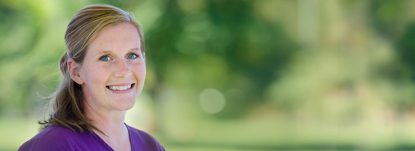 Portrait of a staff member outdoors with a blurred natural background, representing career opportunities and team members like at Milaca Elim Meadows